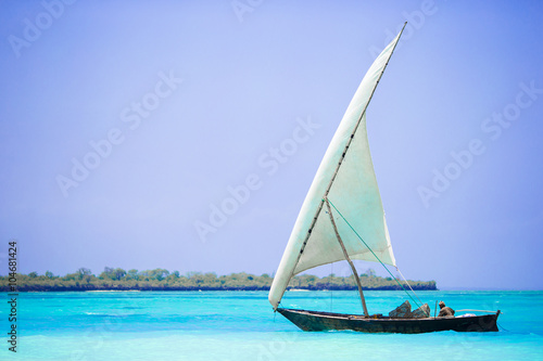 Old wooden dhow in the Indian Ocean near Zanzibar
