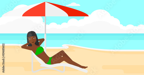 Woman sitting in chaise longue.