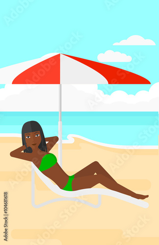 Woman sitting in chaise longue.