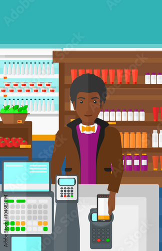 Customer paying with his smartphone using terminal.