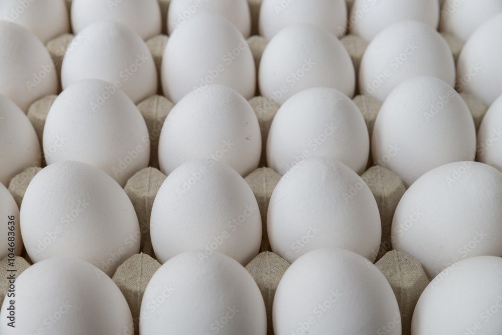 undecorated white Easter eggs in recycled paper tray undecorated white Easter eggs in recycled paper tray