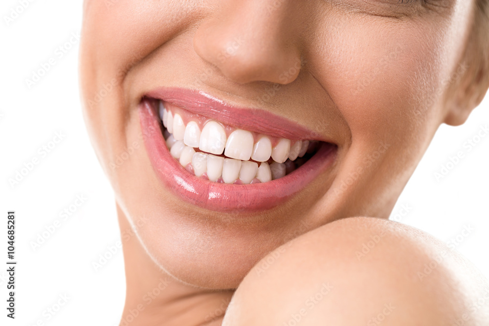 Obraz premium Close up of female face with a clean white teeth
