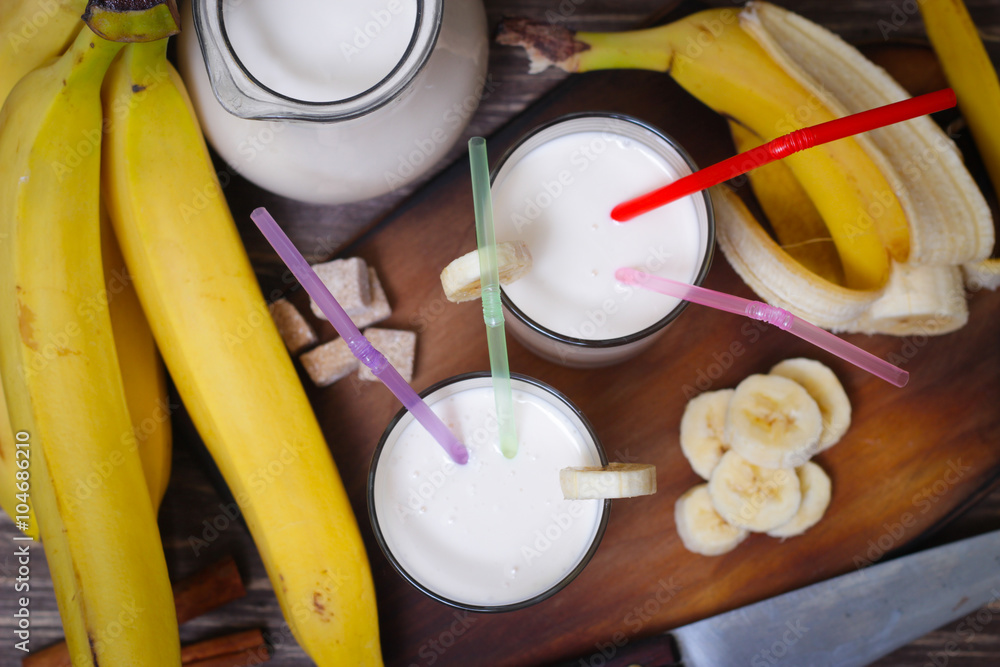 Fresh made Banana smoothie on wooden background Fresh made Banana smoothie on wooden background