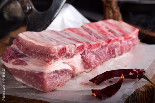 Raw ribs  on a  wooden table