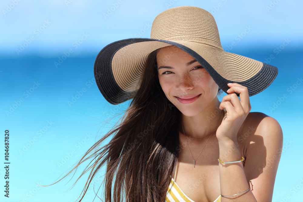 Asian woman with beach hat for face sun protection Stock Photo