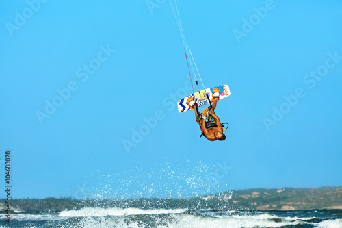 Extreme Water Sport. Kiteboarding, Kitesurfing Action. Professional Kiter Makes Difficult Trick In Air. Active Lifestyle. Hobby. Recreational Sporting Activity. Sports. Summer Fun, Adventure.