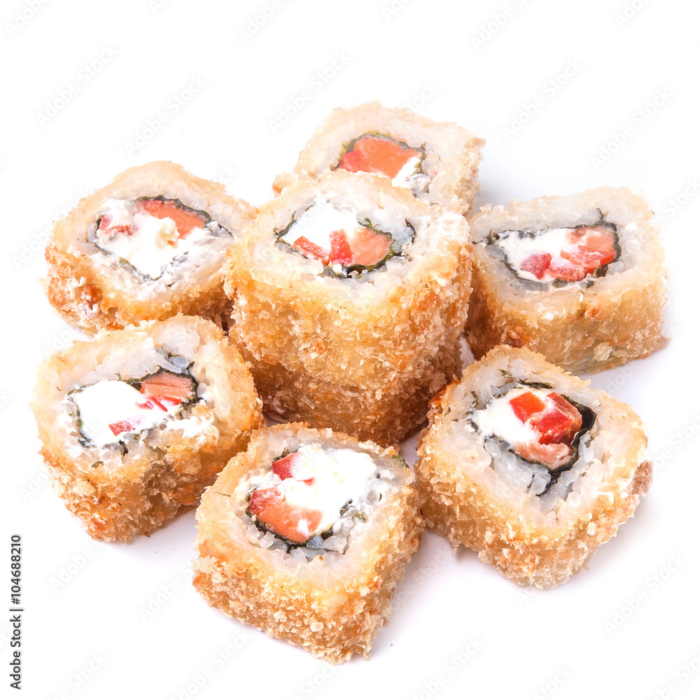 Deep fried japanese tempura roll with paprika, unagi sauce, salmon, cream cheese and crispy breading - isolated in white background Deep fried japanese tempura roll with paprika, unagi sauce, salmon, cream cheese and crispy breading - isolated in white background