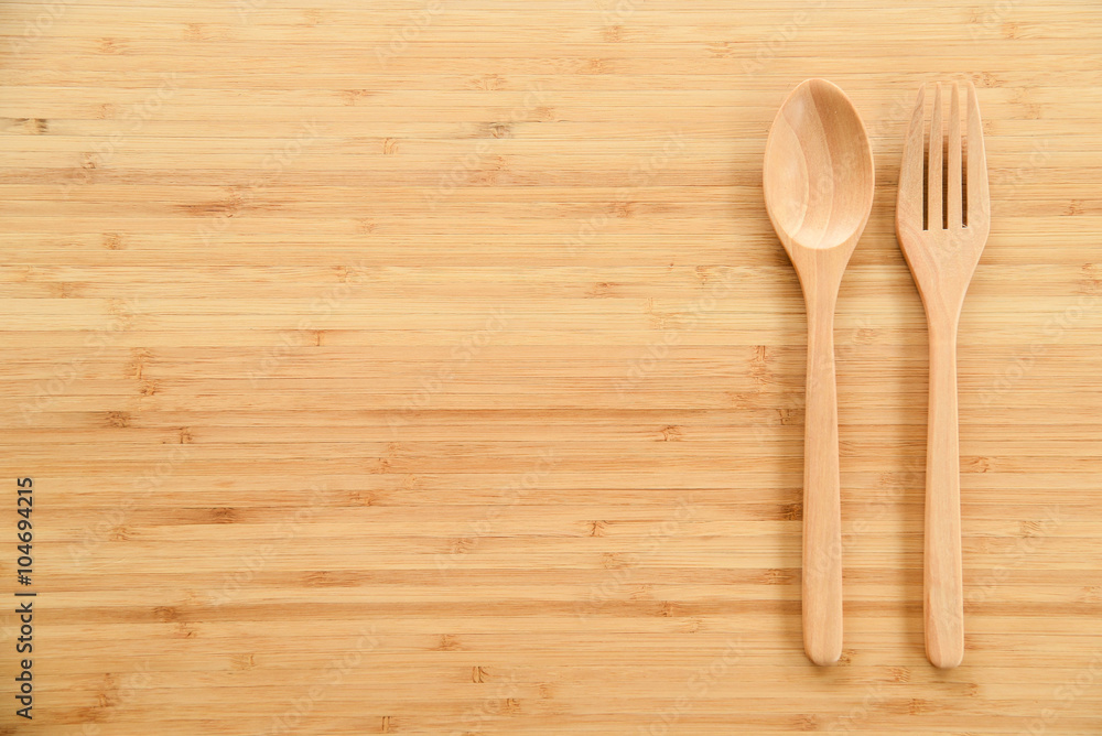 Wooden spoon and fork on table Wooden spoon and fork on table