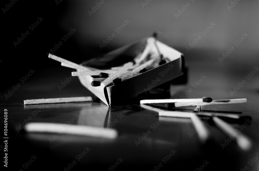 Match box and match sticks lying on floor monochrome Match box and match sticks lying on floor monochrome