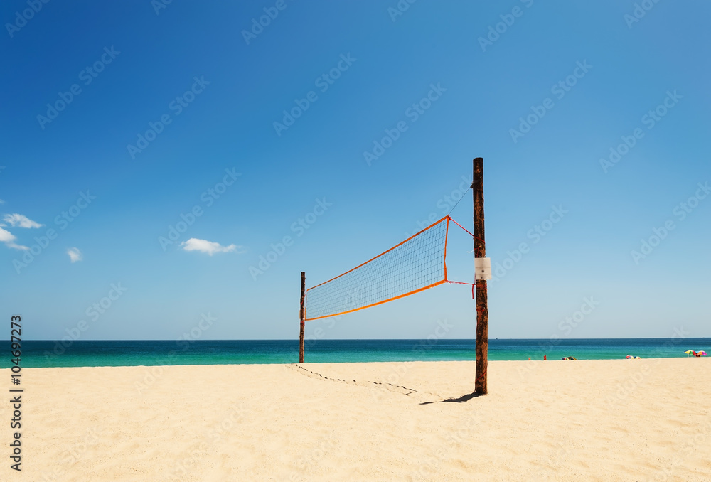 Volleyball net on the beach and tropical sea Volleyball net on the beach and tropical sea