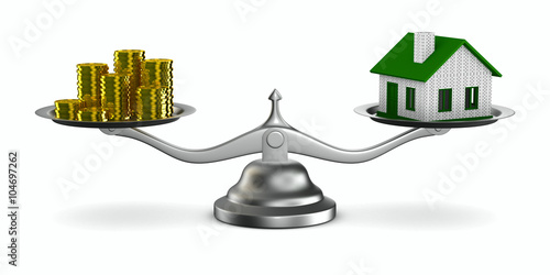 House and money on scales. ...