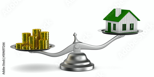 House and money on scales. ...