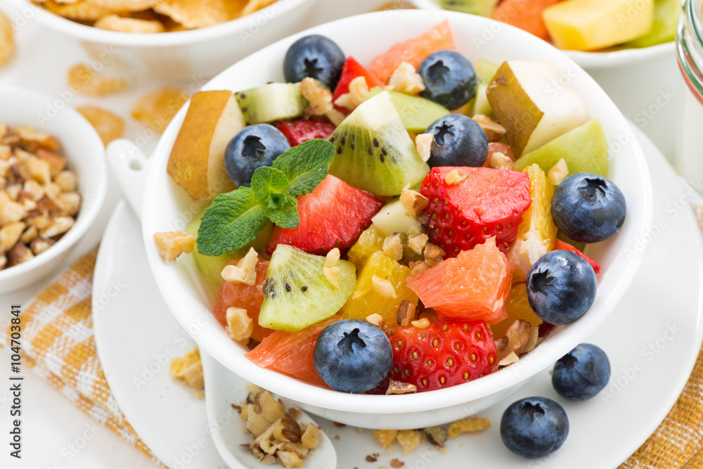 breakfast with fruit salad and corn flakes, closeup top view breakfast with fruit salad and corn flakes, closeup top view