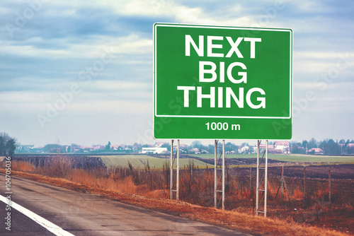 Behang Next big thing ahead conceptual image with road sign