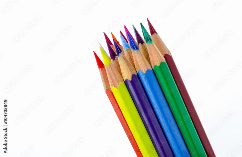 Many colored wooden pencils on white.