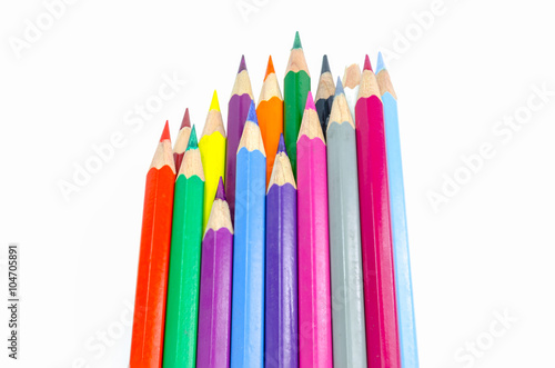 Many colored wooden pencils on white.