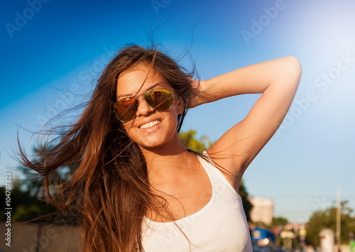 Angelica. tourist blue sky sunglasses white shirt! © erainbow