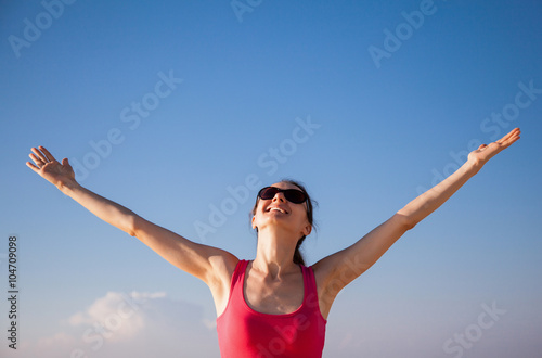 Young woman rejoices at summer vacation