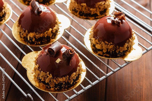 French mousse cake covered with chocolate glaze