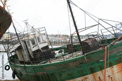 Old and rusty desolate fishing ship in  harbour