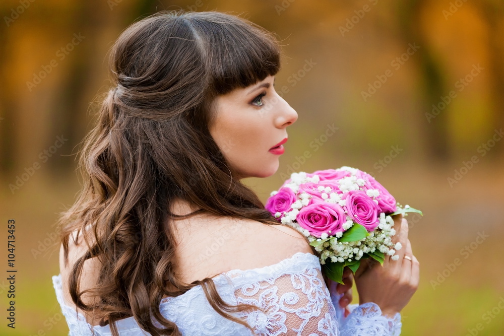 brunette bride autumn background with bouquet brunette bride autumn background with bouquet