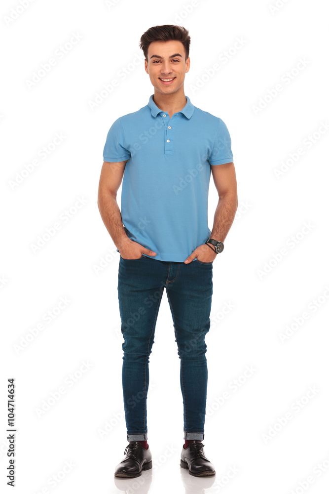 stylish man in blue posing with hands in pockets stylish man in blue posing with hands in pockets