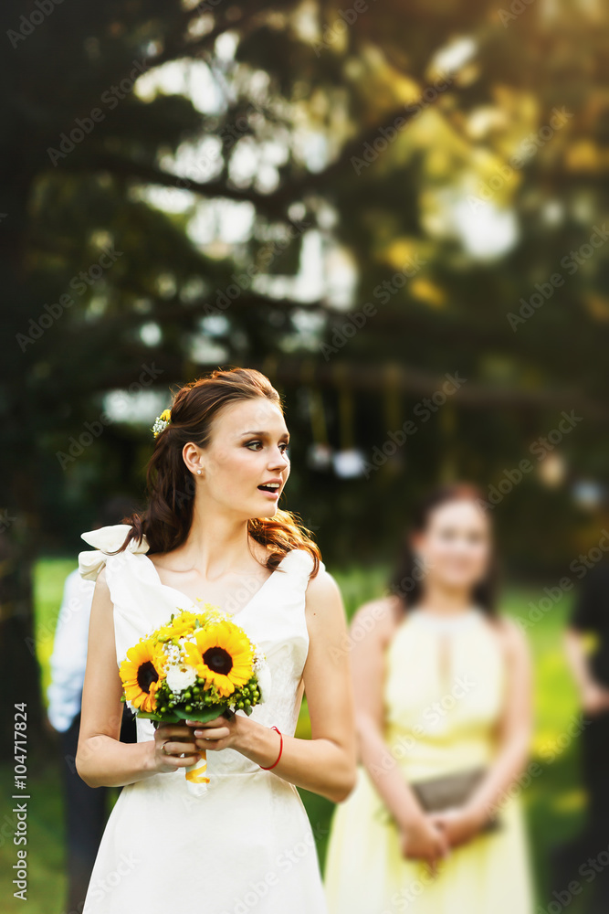 Stylish Fresh smiling bride in a white dress with a bouquet of s Stylish Fresh smiling bride in a white dress with a bouquet of s