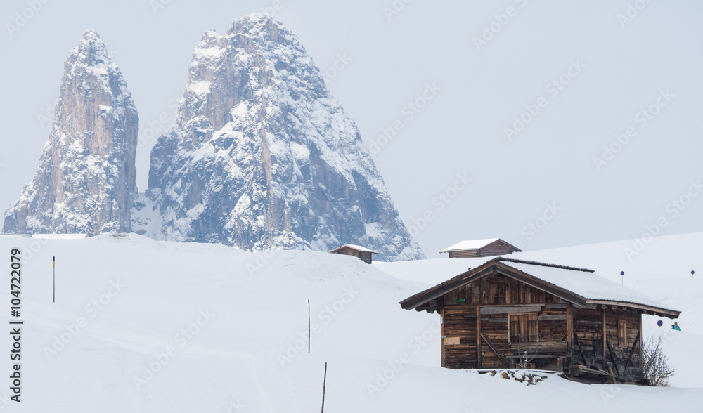 A view of the huts in snow covered landscape in the mountains