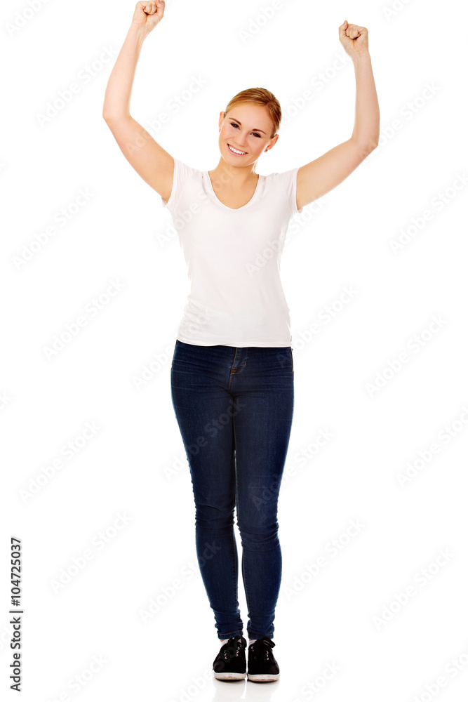 Young happy woman with arms up Young happy woman with arms up