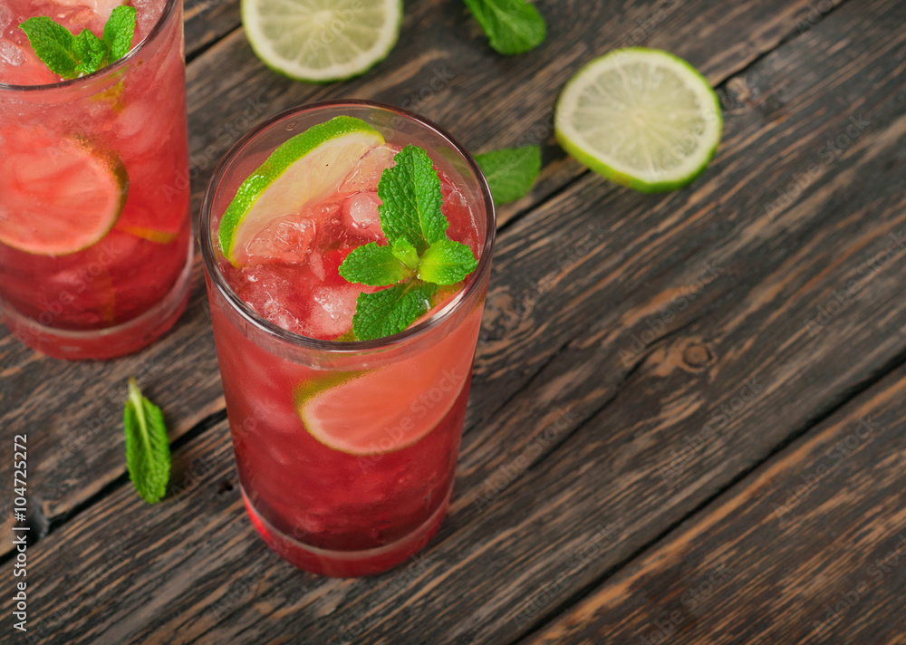 Two red cocktail with ice, lime and mint Two red cocktail with ice, lime and mint