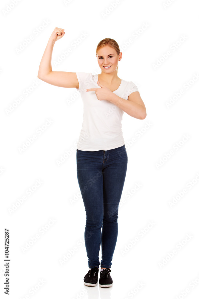 Funny young woman showing her muscles Funny young woman showing her muscles