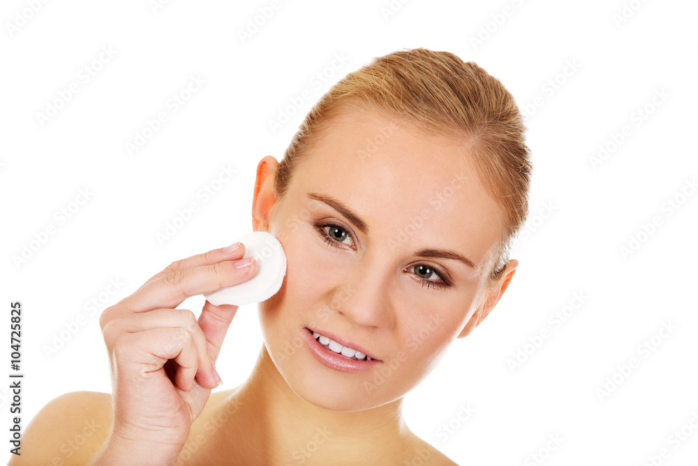 Beautiful woman using cotton pad Beautiful woman using cotton pad