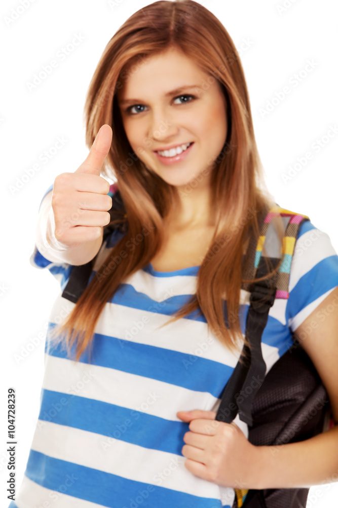 Happy schoolgirl with backpack and thumb up Happy schoolgirl with backpack and thumb up