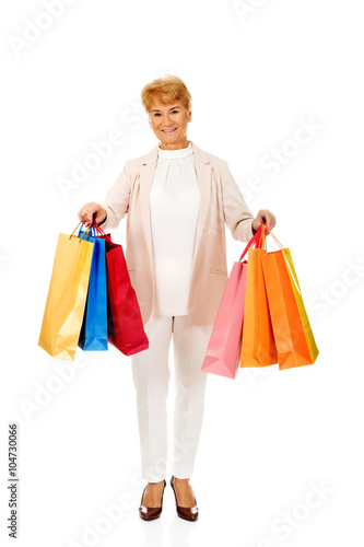 Happy business woman holging shopping bags