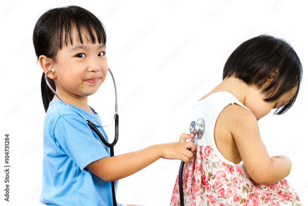 Asian Little Chinese Girls Playing as Doctor and Patient with St
