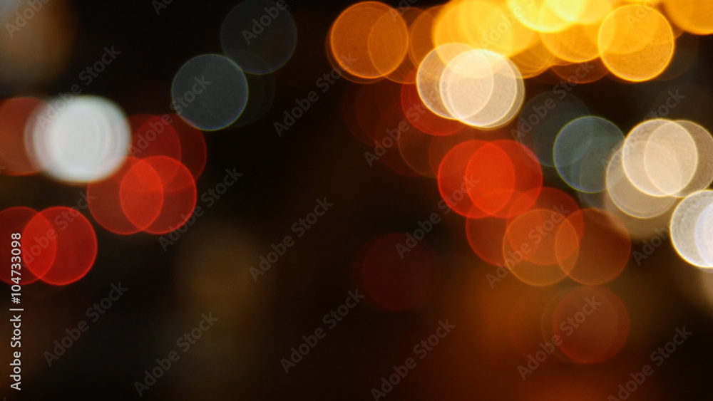 Beautiful bokeh background on dark, out of focus lights during the night