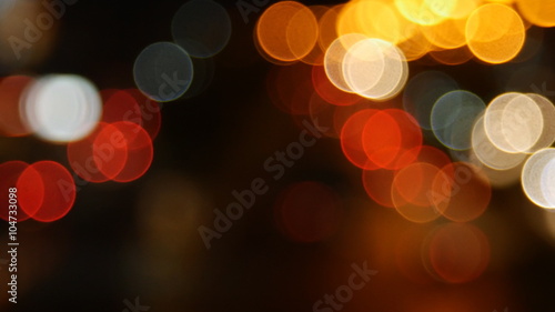 Beautiful bokeh background on dark, out of focus lights during the night
