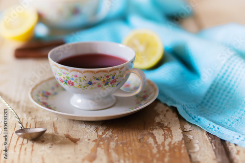 Cup of tea on wooden table. vintage scene.