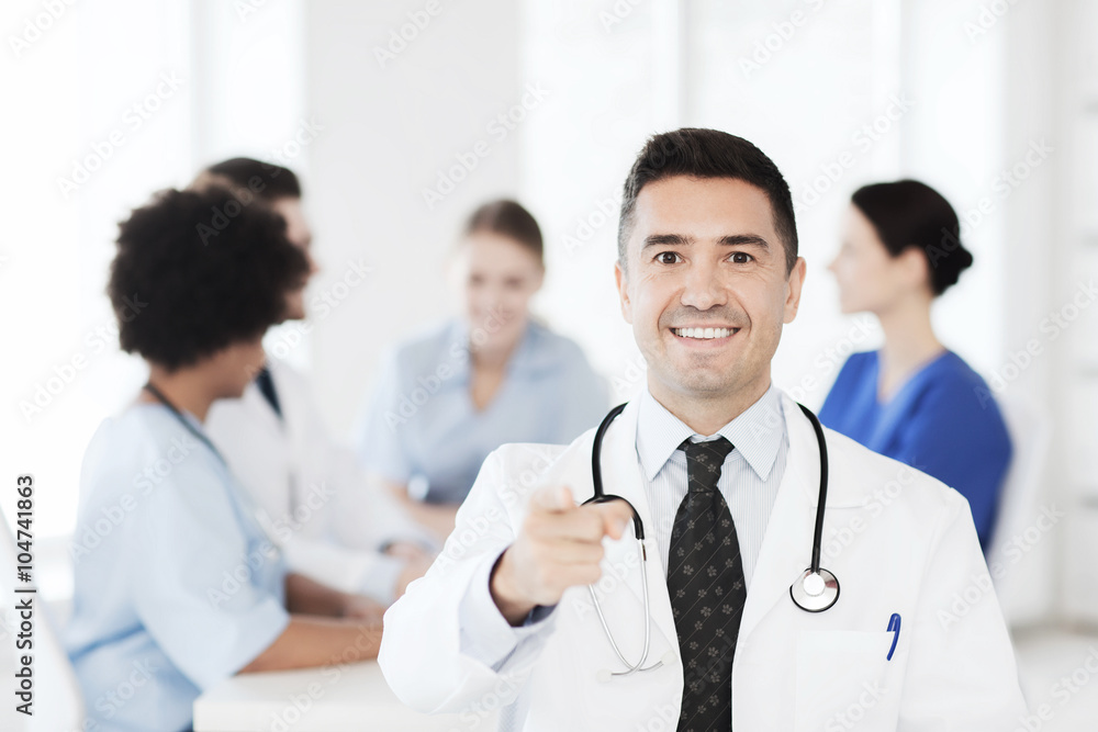 happy doctor over group of medics at hospital happy doctor over group of medics at hospital