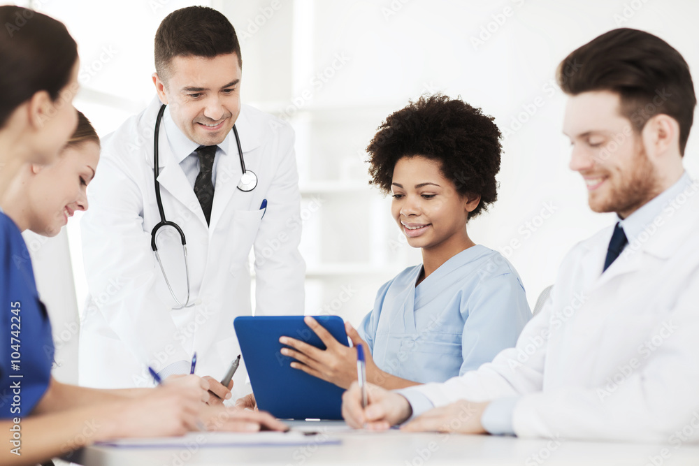 group of happy doctors meeting at hospital office group of happy doctors meeting at hospital office
