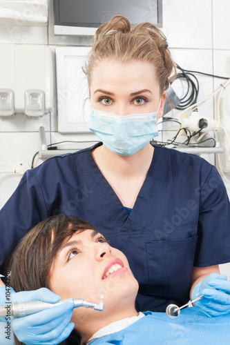 Portrait of young patient during oral checkup at the dentist