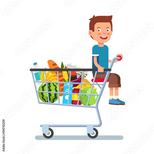 Kid sitting in a supermarket shopping cart