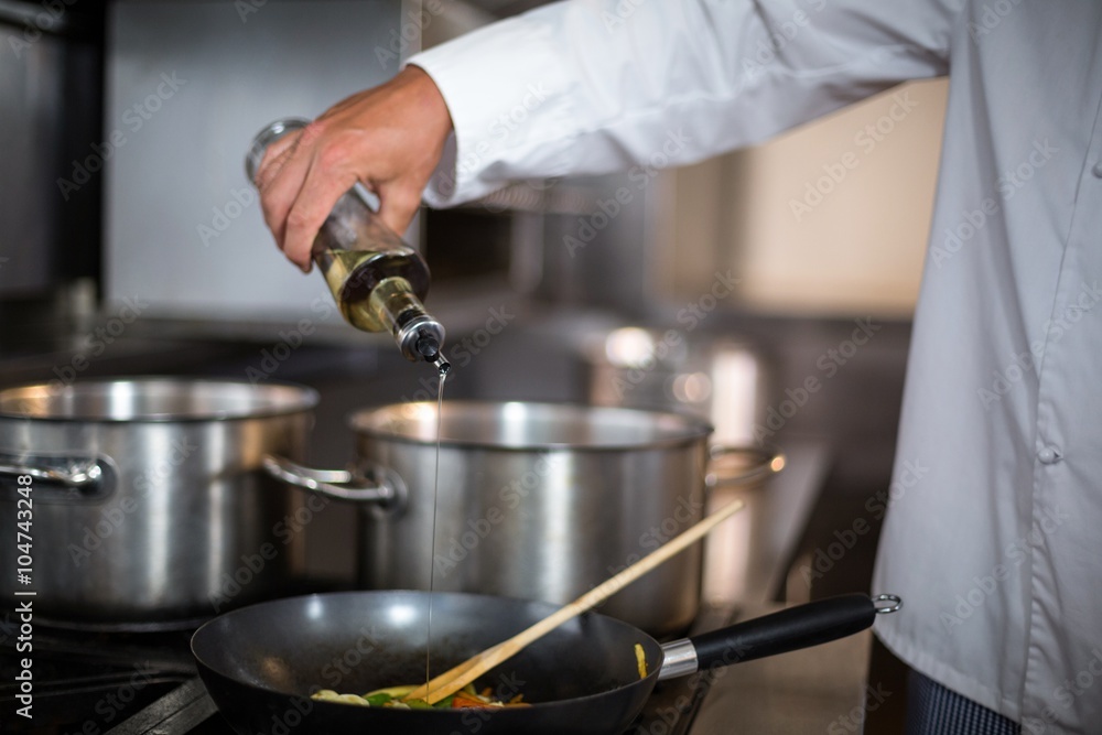 Chef making a stir fry Chef making a stir fry