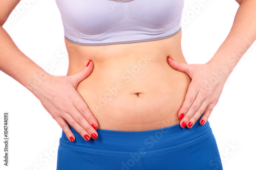 Girl after exercise squeezes your hands belly.