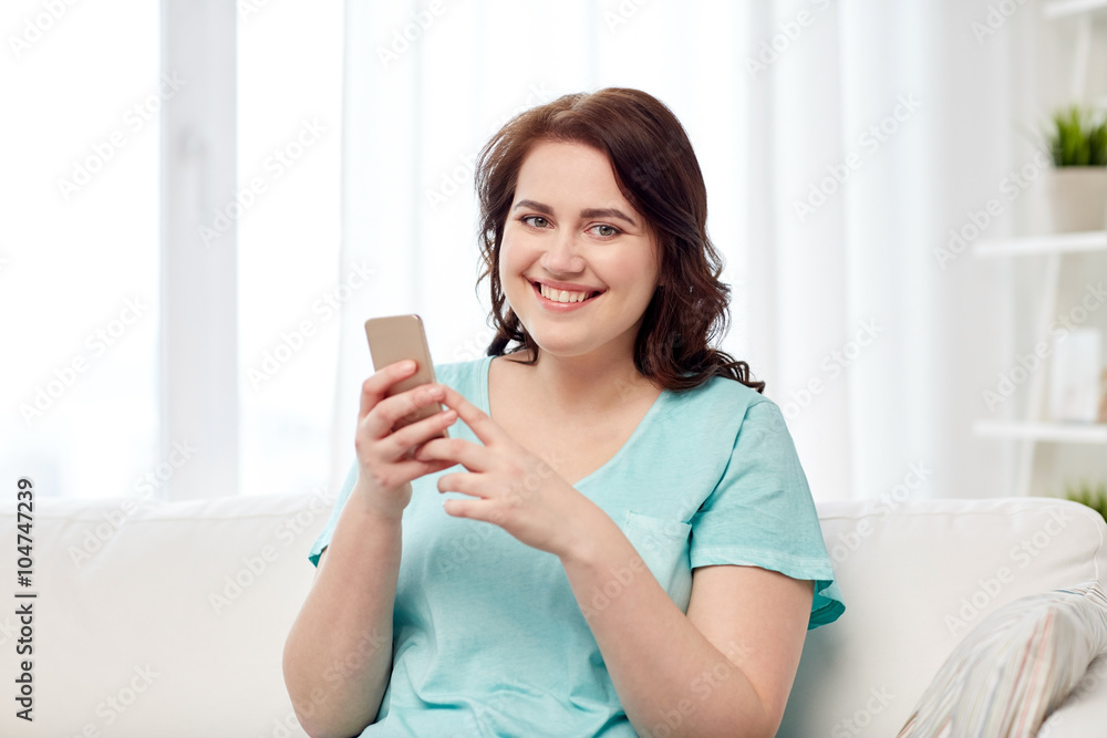 happy plus size woman with smartphone at home happy plus size woman with smartphone at home