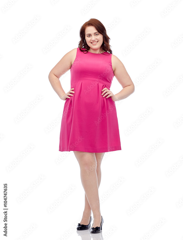 happy young plus size woman posing in pink dress happy young plus size woman posing in pink dress