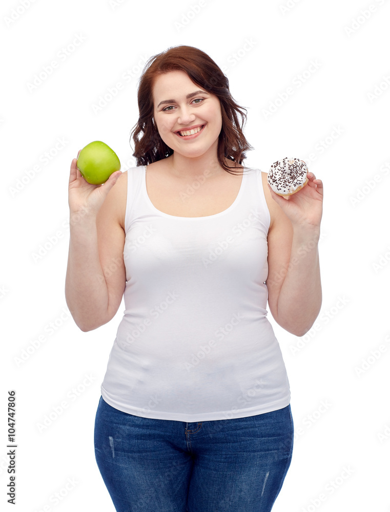 happy plus size woman choosing apple or cookie happy plus size woman choosing apple or cookie