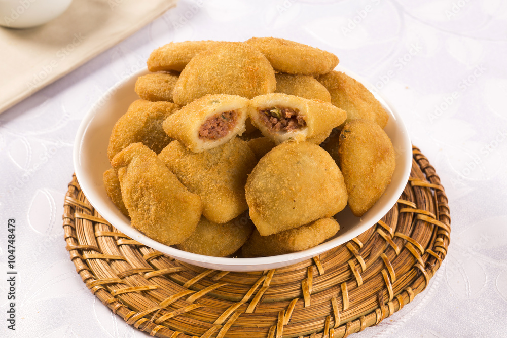Rissole - Meat rissole served with chili sauce. Rissole - Meat rissole served with chili sauce.