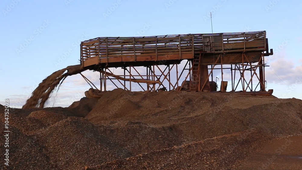 Gold mining. Flushing breed with the old dredge Gold mining. Flushing breed with the old dredge