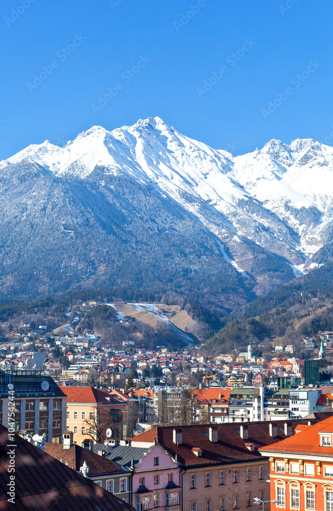 Austria, Tyrol, panoramic wiew over Innsbruck and Inn valley with the snowy mountains in the background